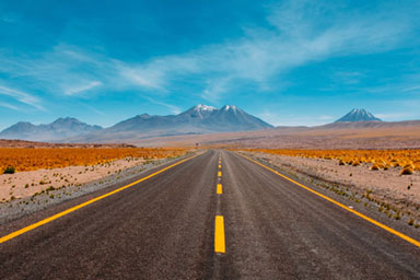 A road leading through a desert landcsape