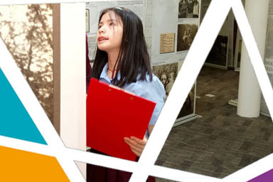 A young schoolgirl looking at a museum display