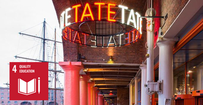 A neon name sign outside Tate Liverpool