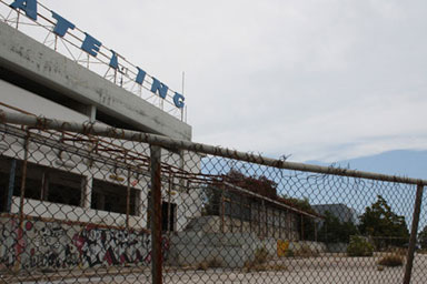 A building behind a wire fence