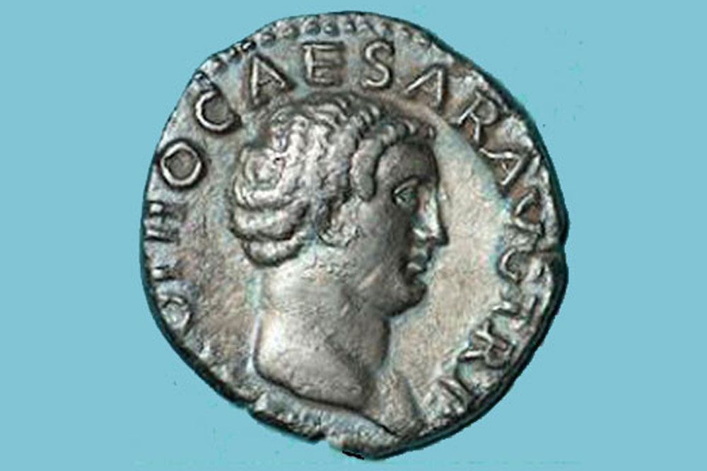 A Roman coin on a blue background