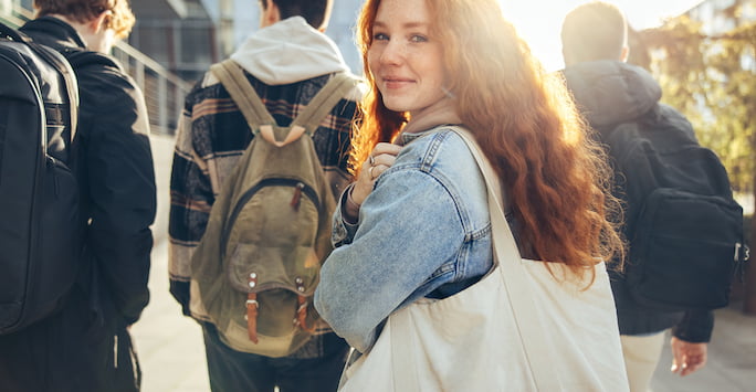 Young person walking on campus