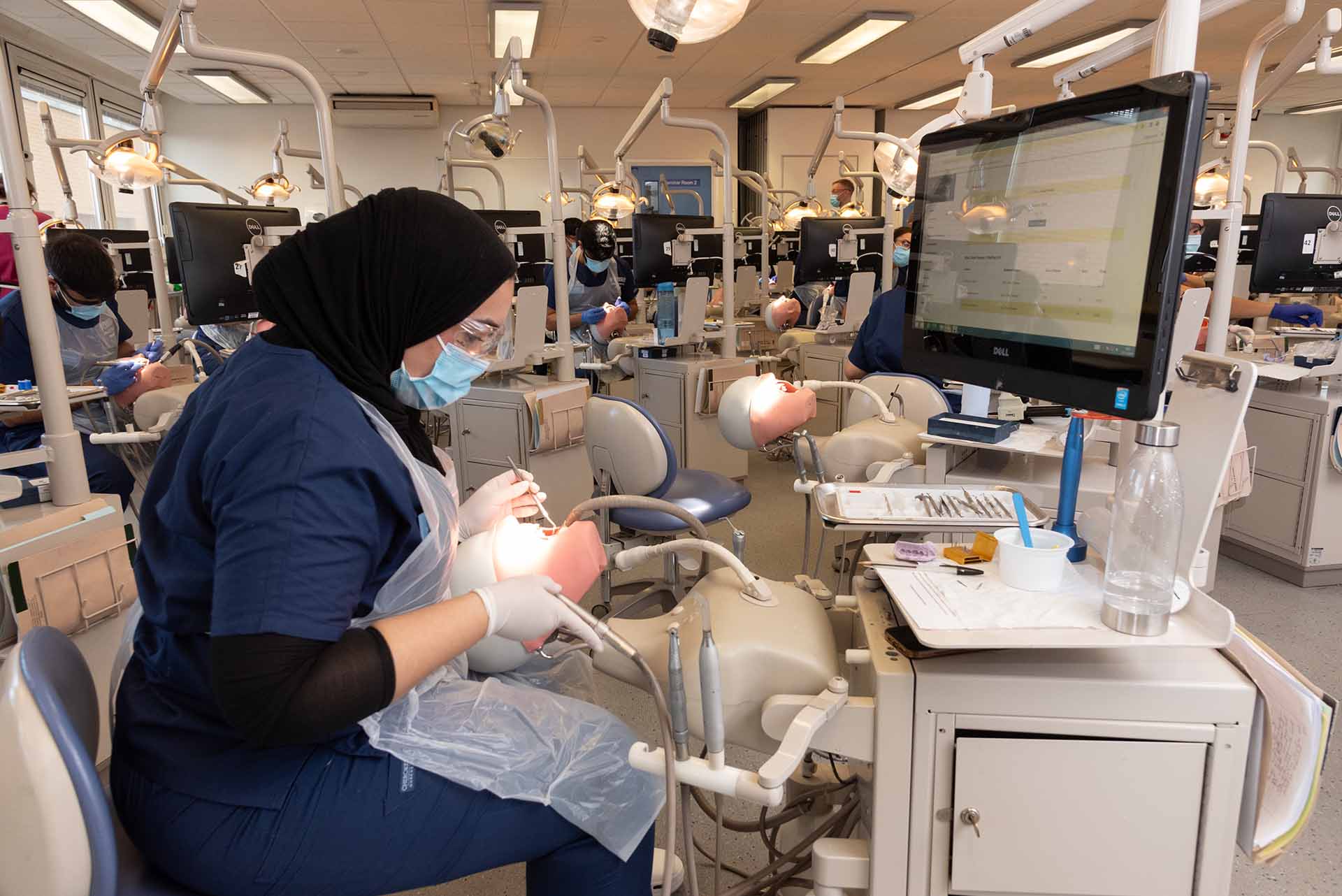 Dentistry student working on simulation patient