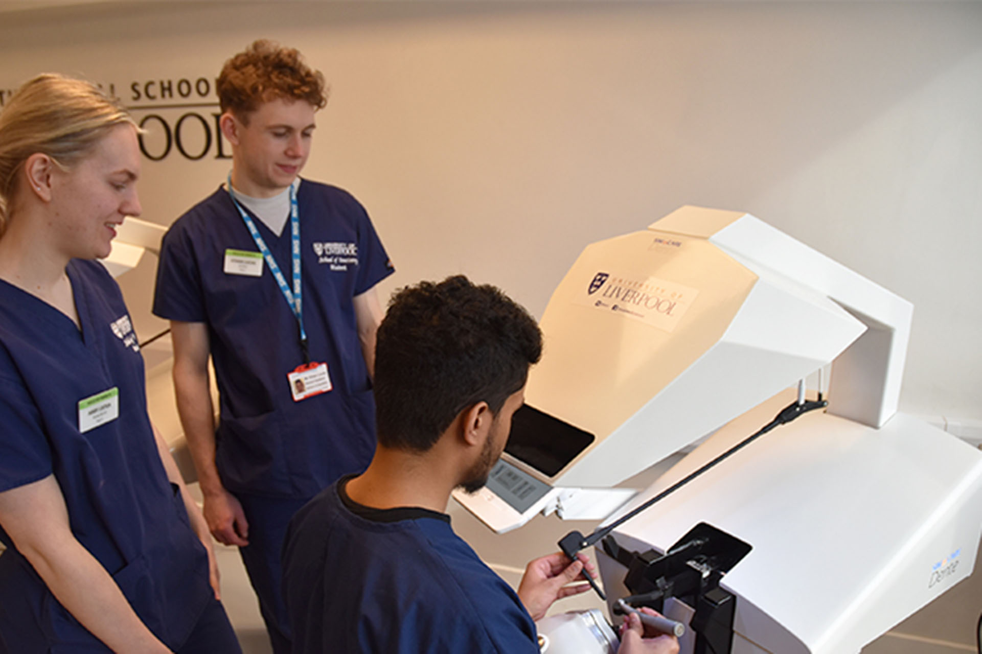 three students at work