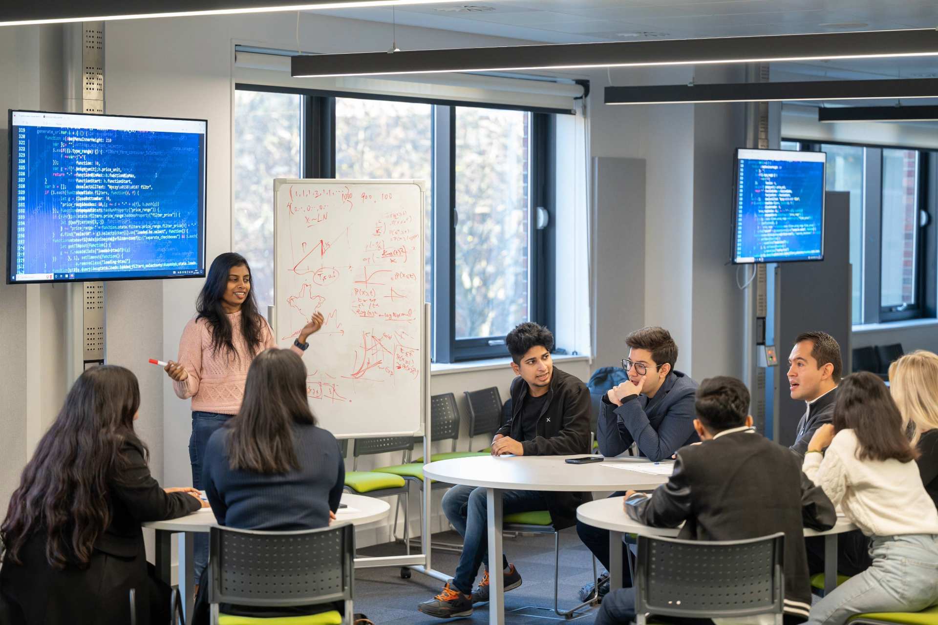 Master's students in a classroom