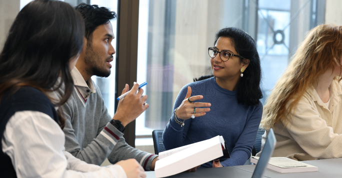 PhD students discussing their research projects.