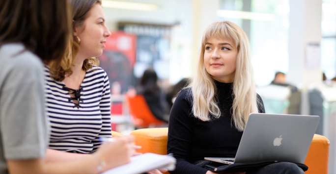 Group of PhD students discussing their research ideas