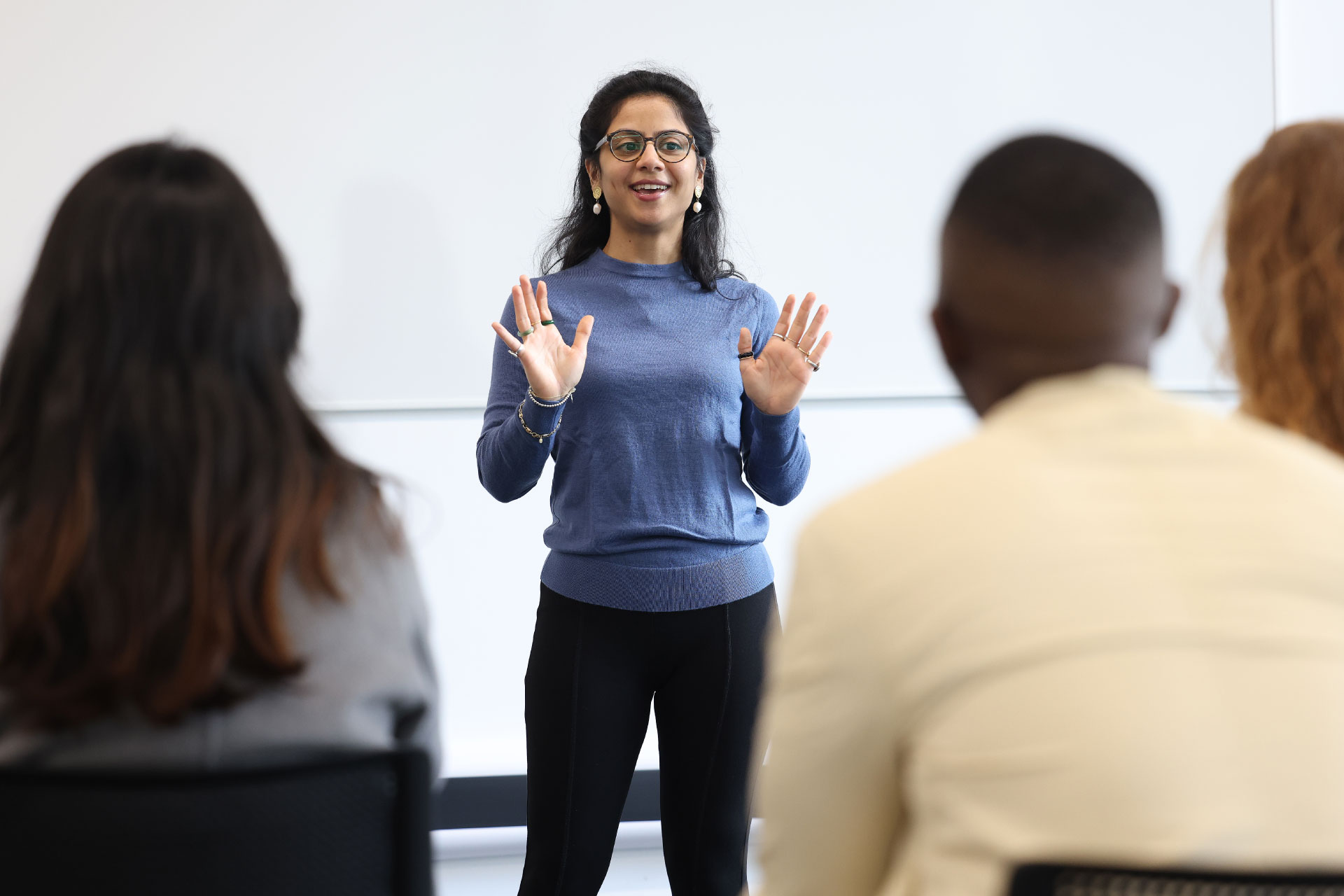 T4 Female student doing a presentation in front of other students