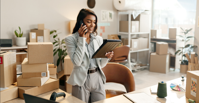 Young female entrepreneur answering a business call