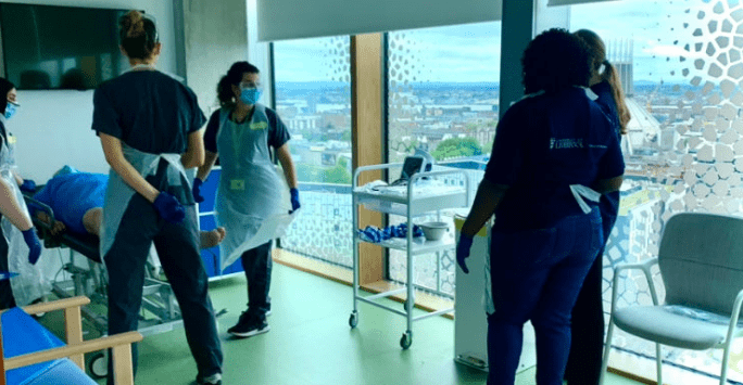 student doctors take part in a simulated clinical session