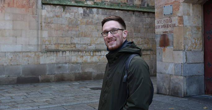 student in front historic building