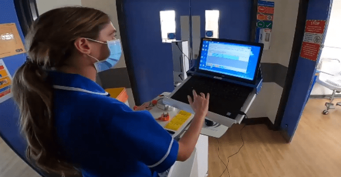 nurse in mask distributing medication