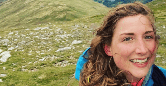 woman student hiking in the hills