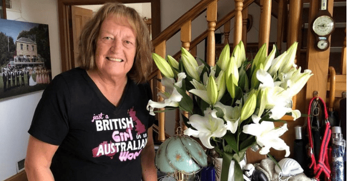 woman with large vase of flowers