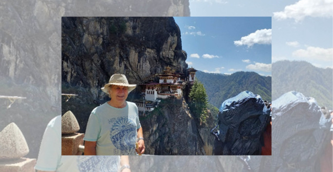 man wearing hat on hilly landscape