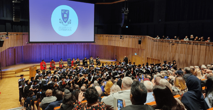 graduates clap their loved ones