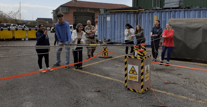 students participate in an army training activity