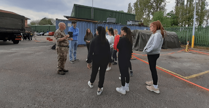 students participate in an army training activity