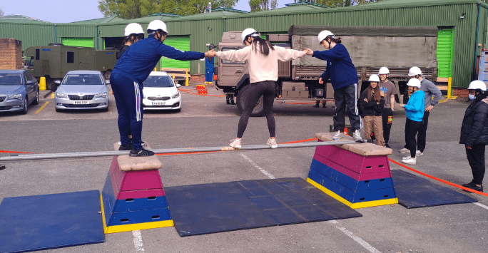 students participate in an army training activity