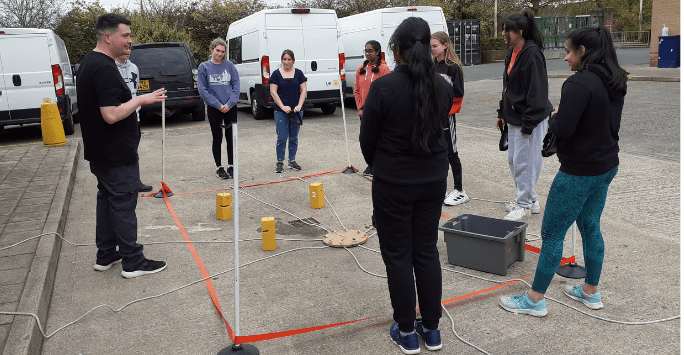 students prepare for an activity lifting blocks