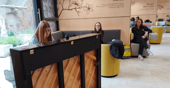 a student plays a piano