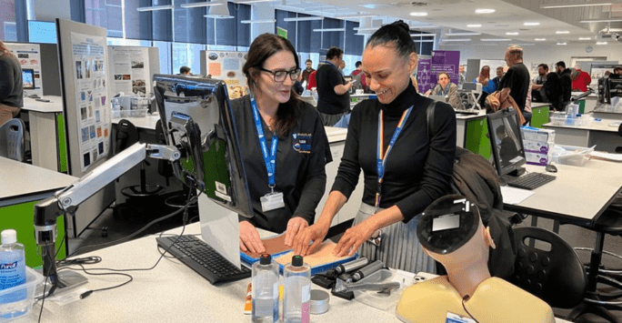 attendees interact with equipment at technical showcase