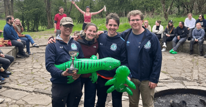 Students pose with inflatable crocodiles