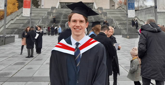 graduate outside cathedral