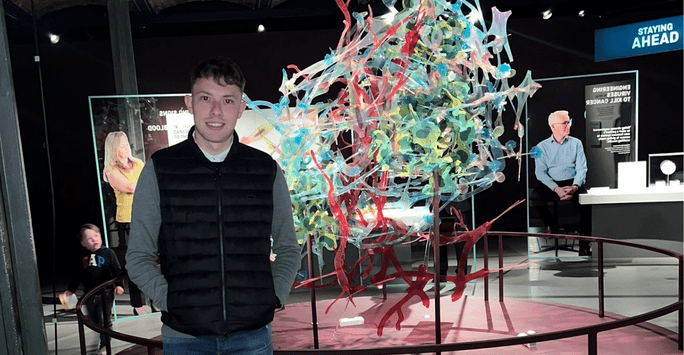 male student at a science exhibition