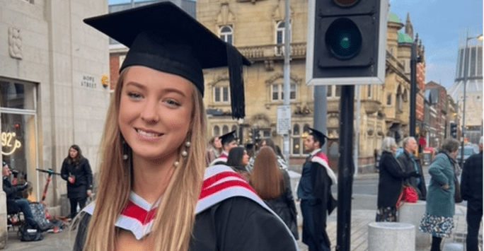 student in graduation cap and gown