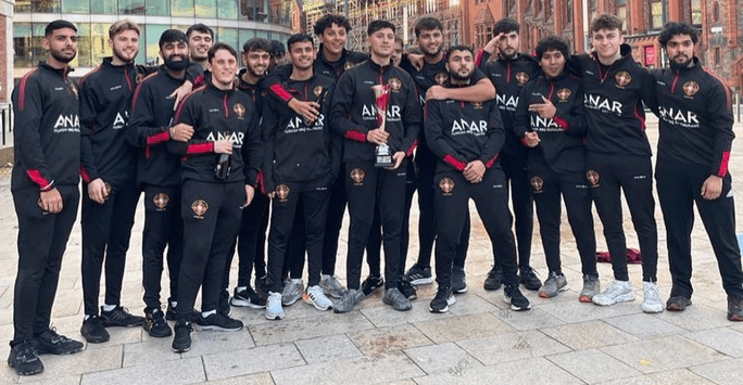 students in matching tracksuits on university square