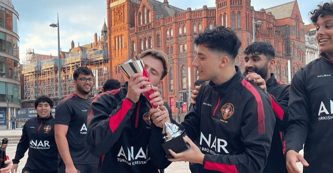 a player kisses a trophy