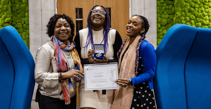 a prize winner poses with her family