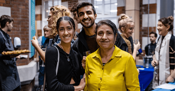 a prize winner poses with her family