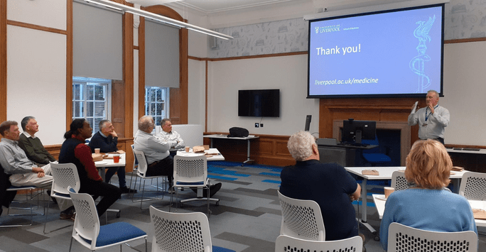 a man presents to a group of people