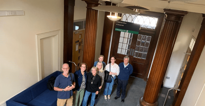 group of people at building foyer