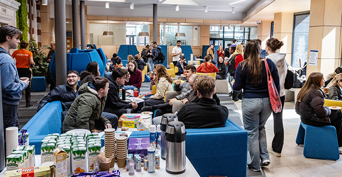 Student Hub busy with students chatting