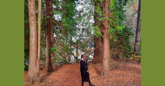 student smiling in forest