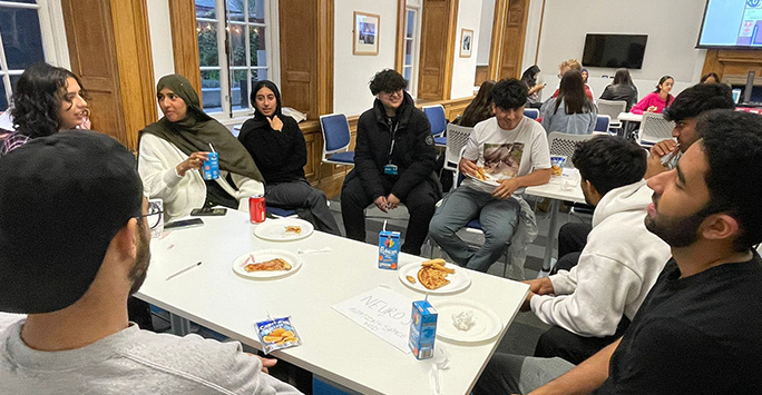 Students enjoying pizza