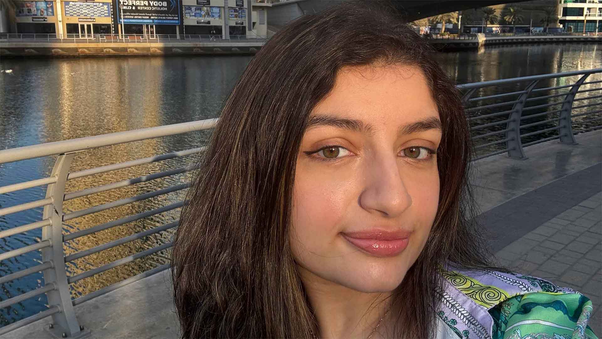 woman at a riverside location