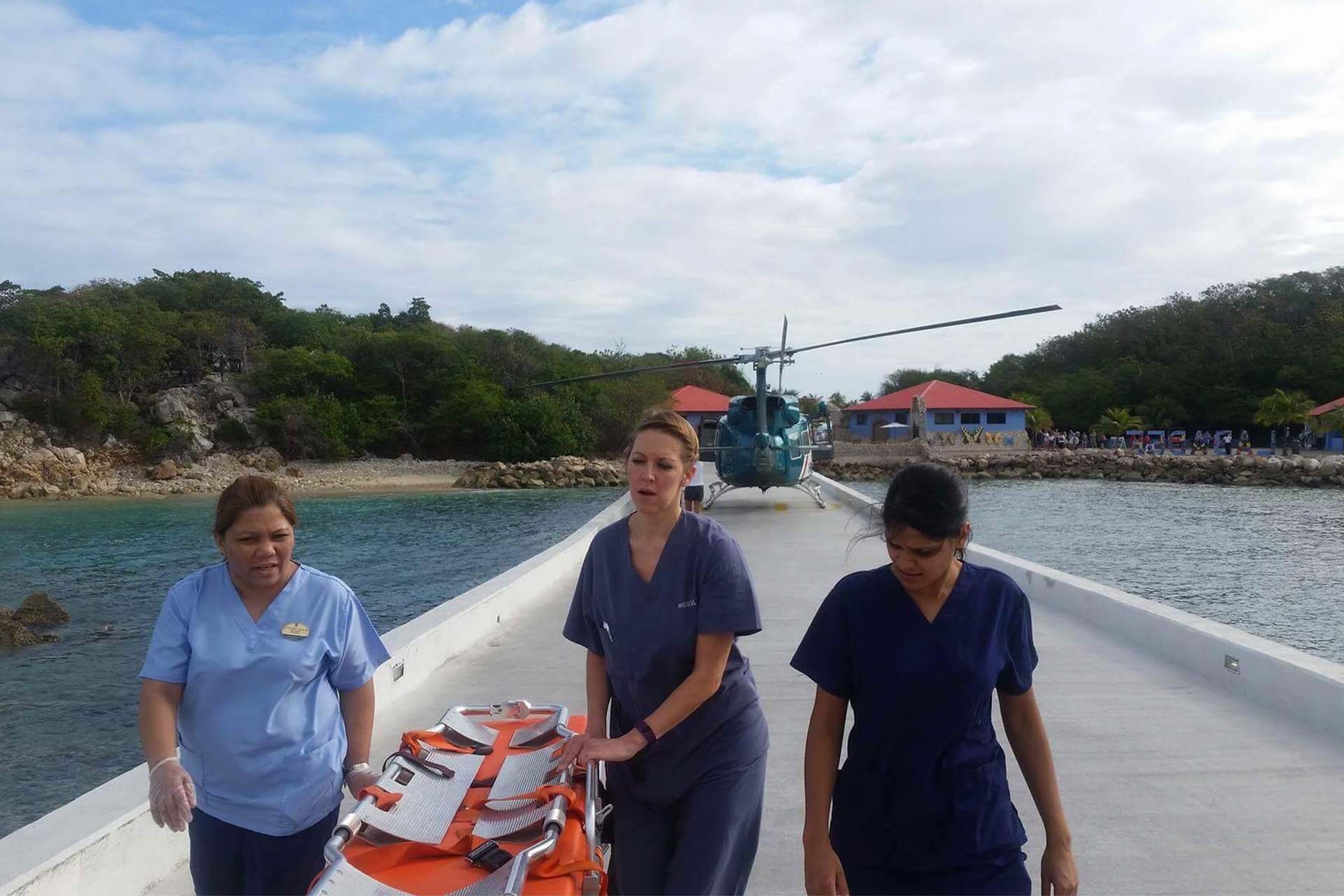 doctors move a stretcher in front of a helicopter