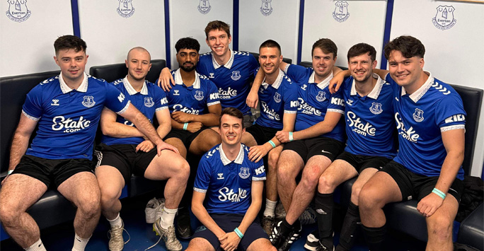 LMSFC team in dressing room in Everton kit