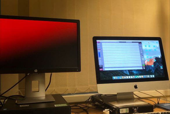 Two computer screens in an EEG lab