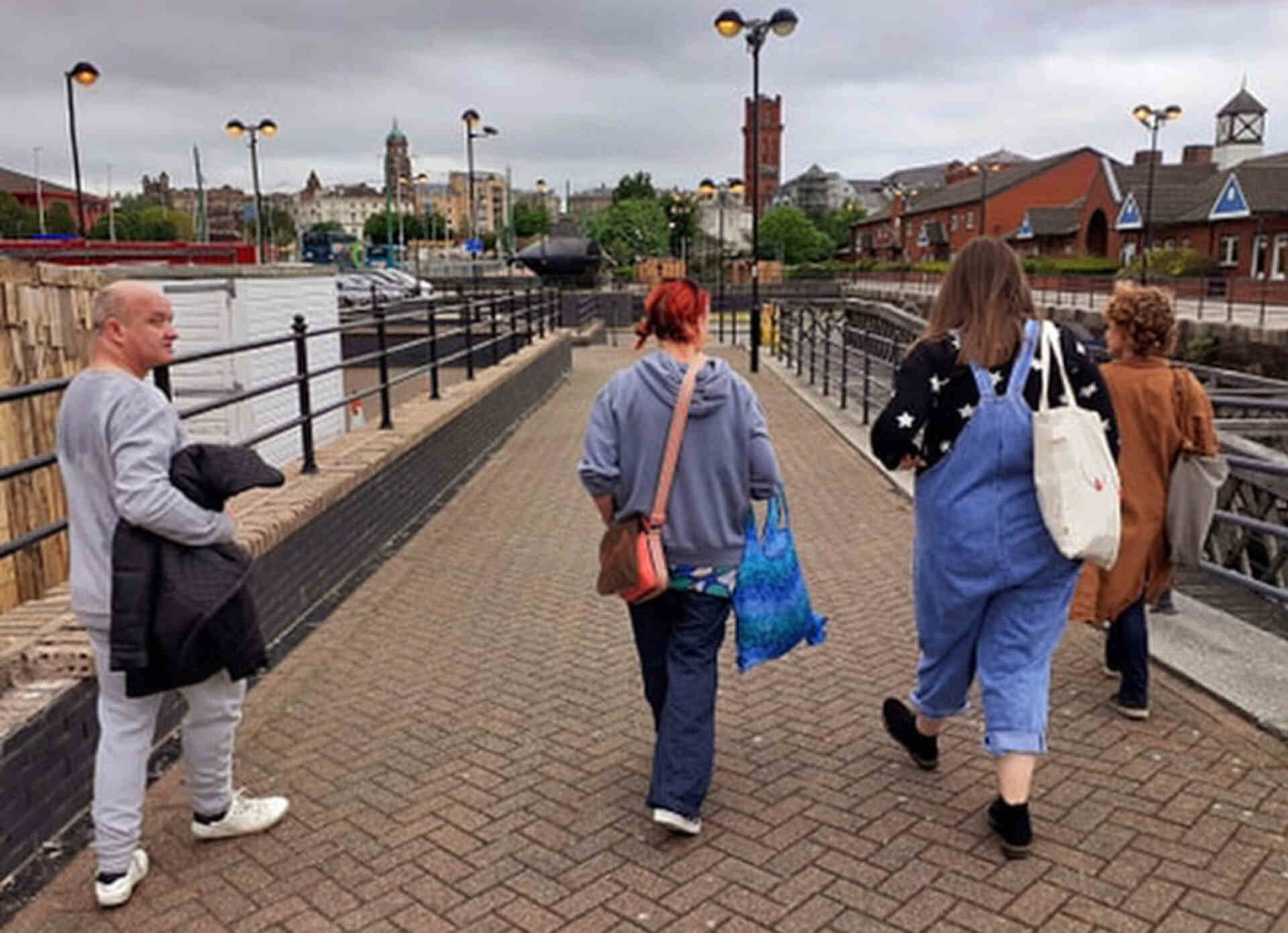 People walking across a bridge