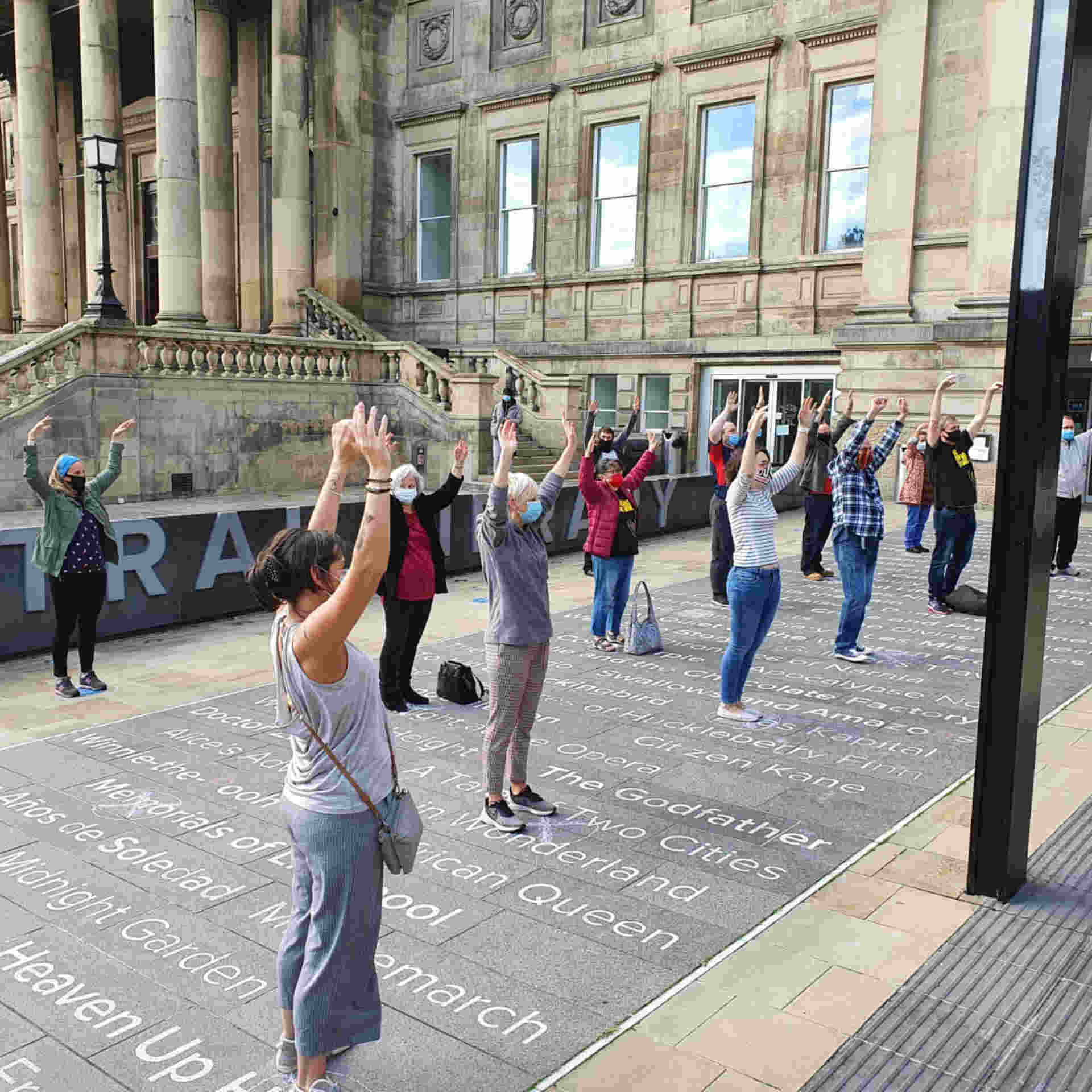 Choir performing outside a museum