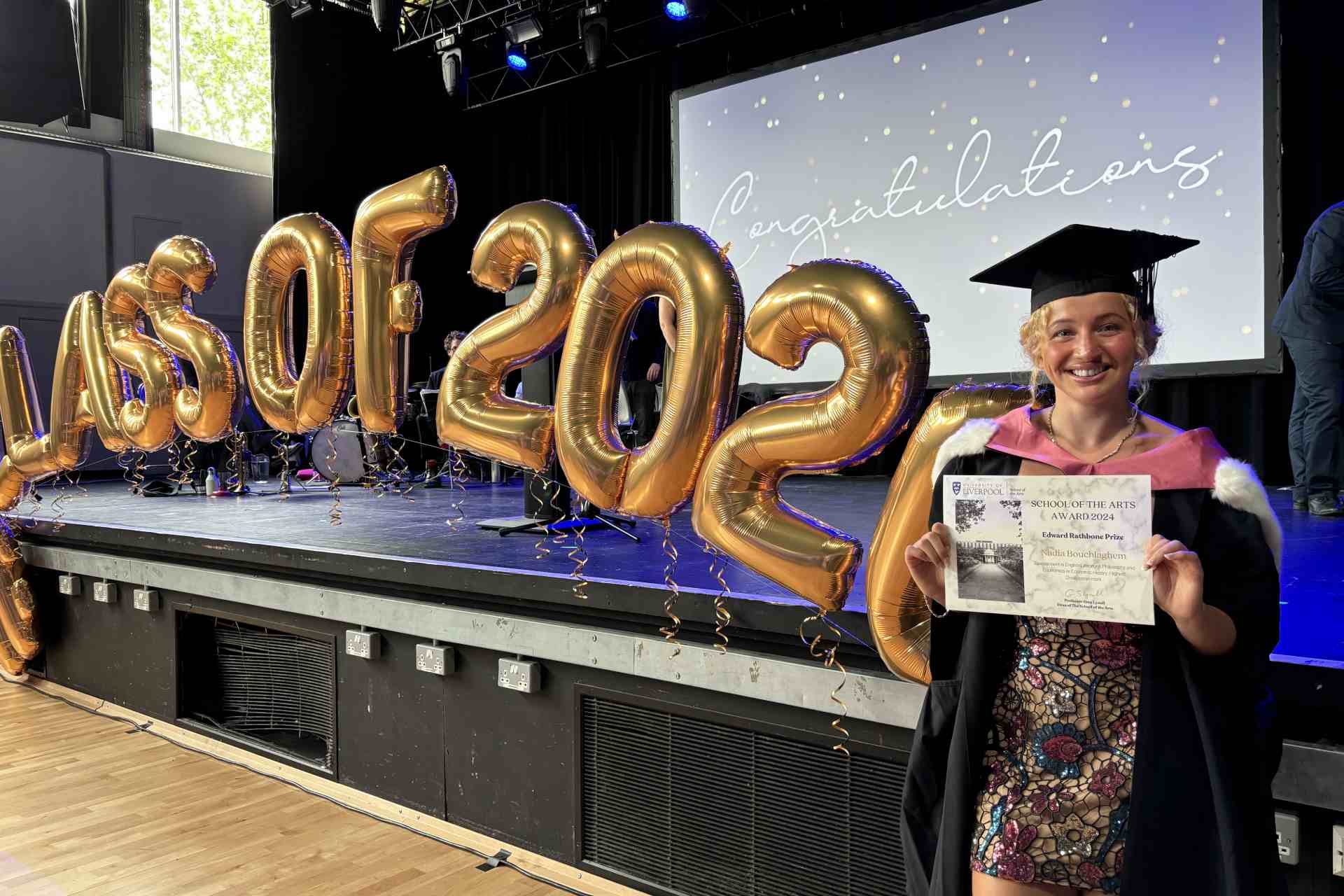 Philosophy graduate holding certificate