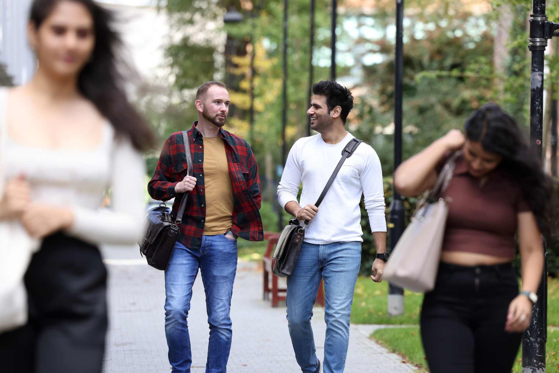 Postgraduate students walking and chatting