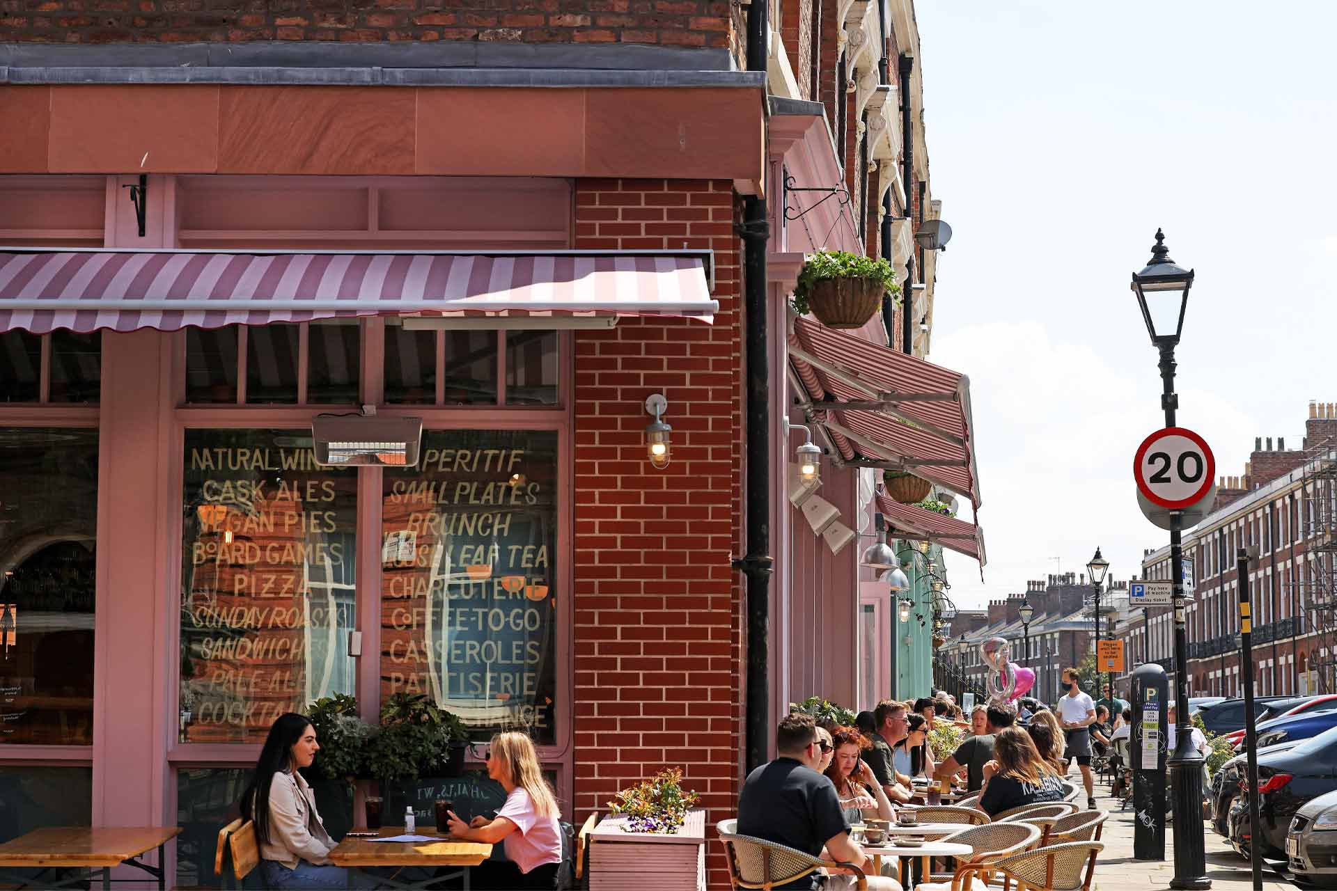 People chatting in the outside seating areas of Hope Street's cafes