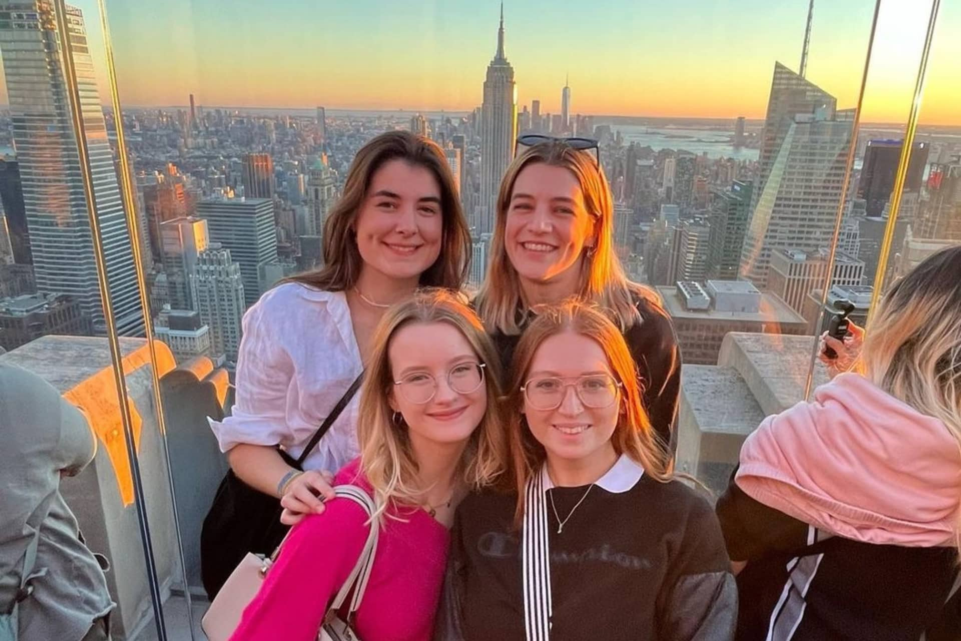 4 students stood with the Empire State Building in the background