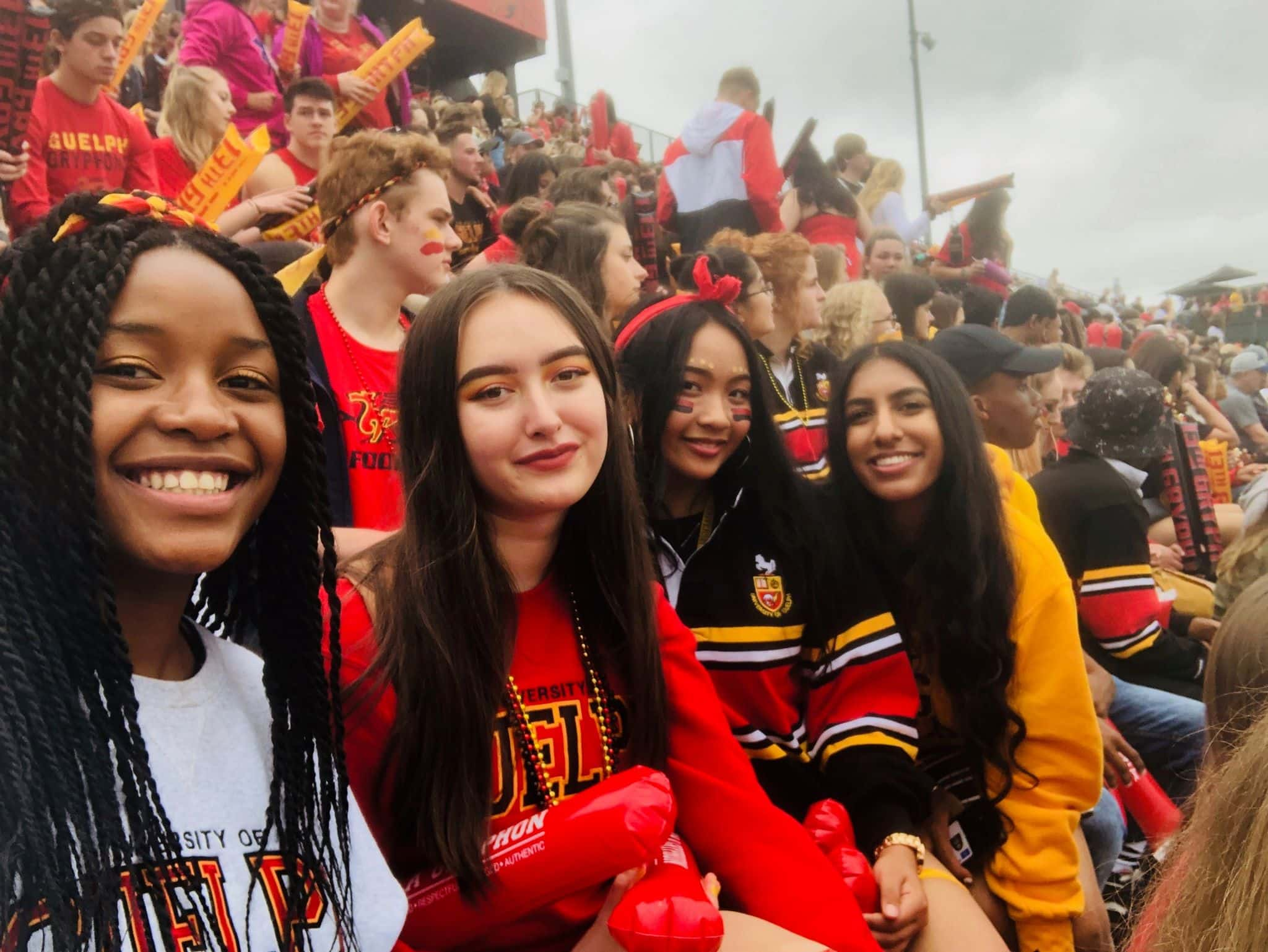 4 students watching sports at the University of Guelph, Canada